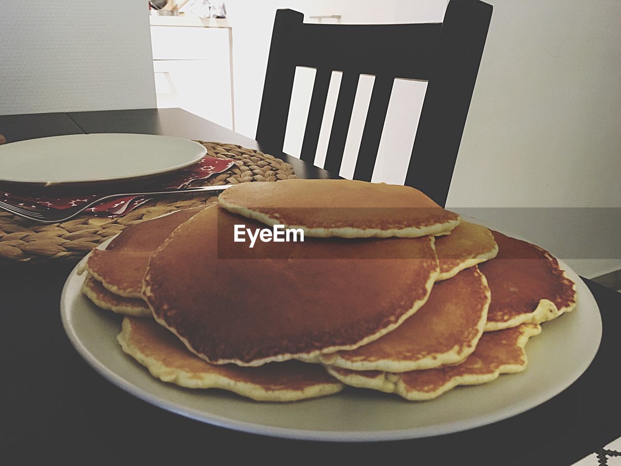 Pancakes served in plate on table