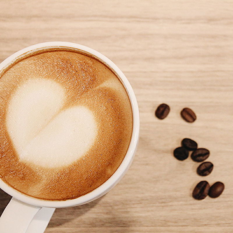 CLOSE-UP OF COFFEE CUP ON TABLE