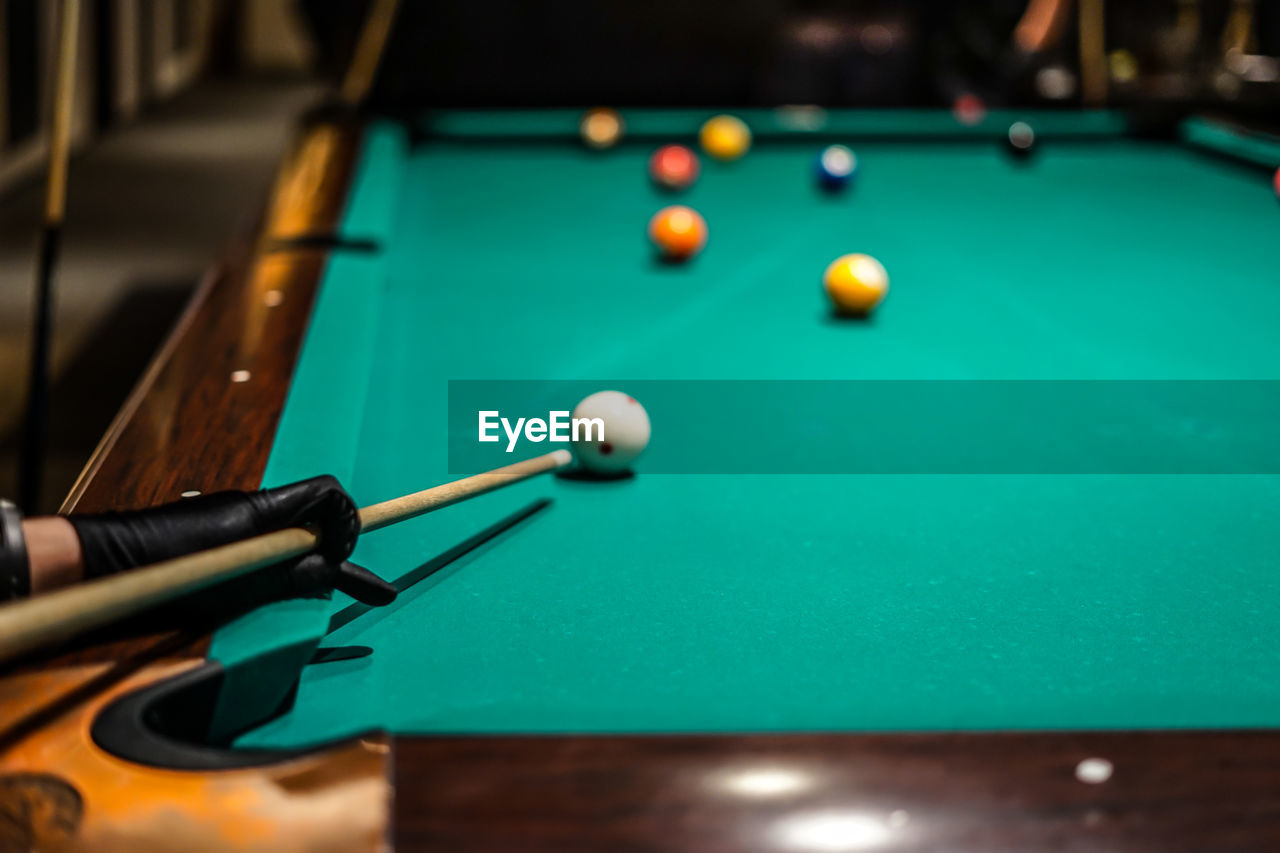 cropped image of man playing pool