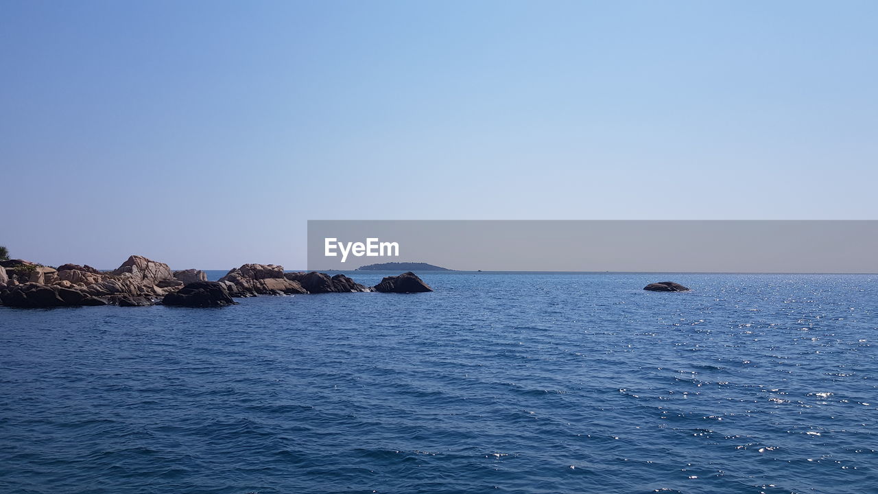 SCENIC VIEW OF SEA AGAINST BLUE SKY