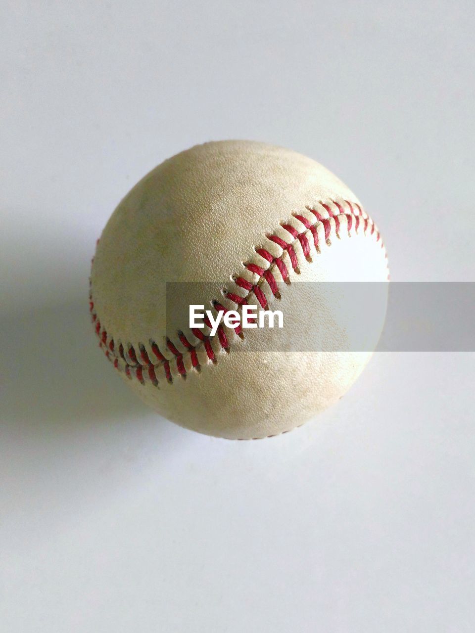Directly above shot of baseball on gray background