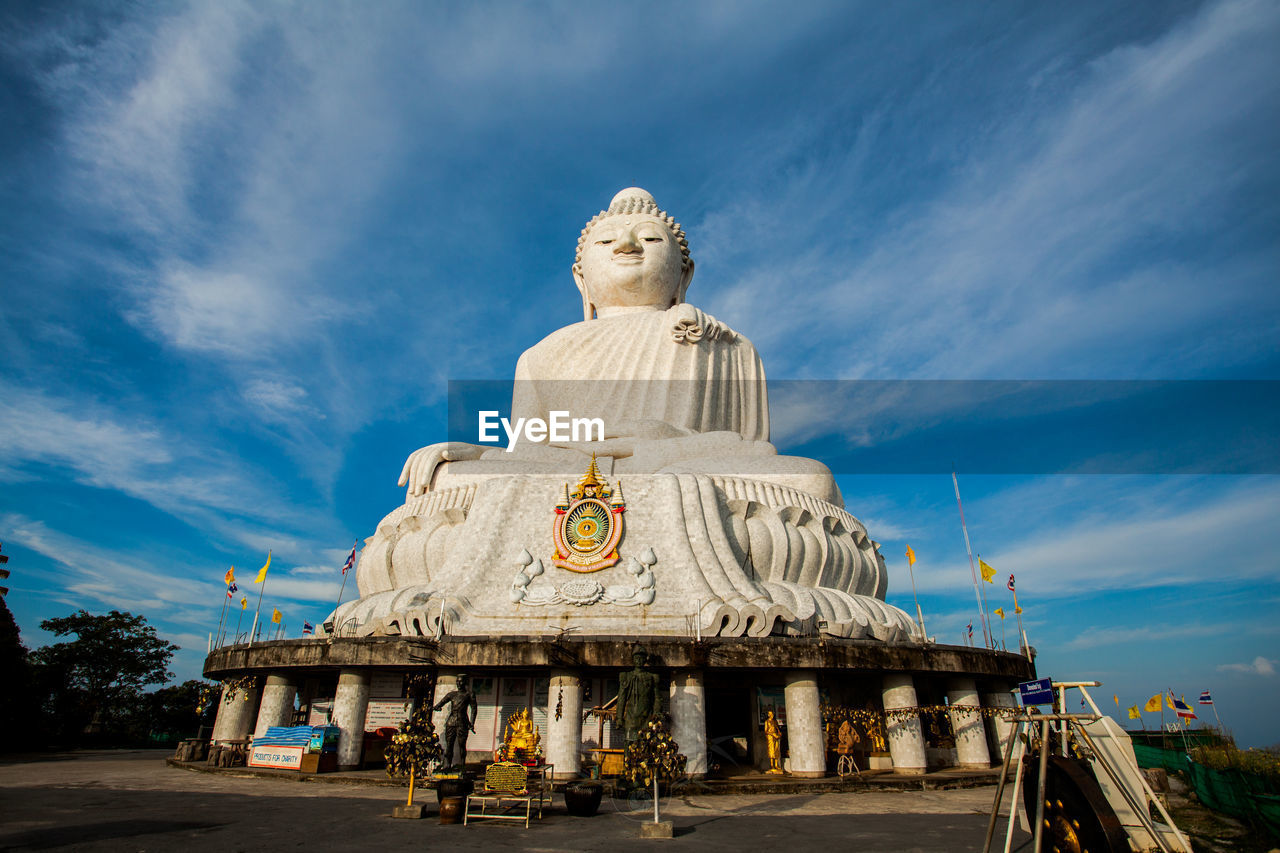 Giant buddha statue against sky