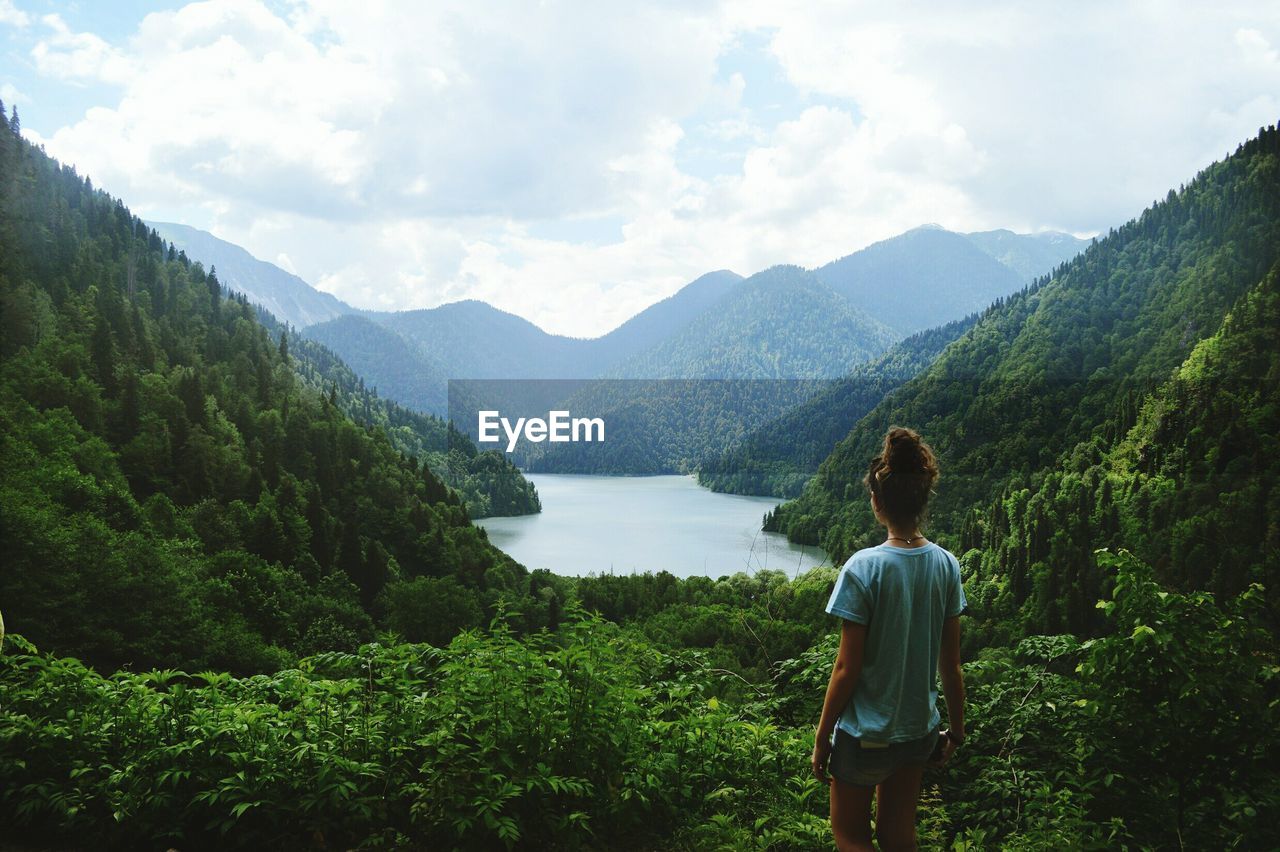 Rear view of woman looking at mountains