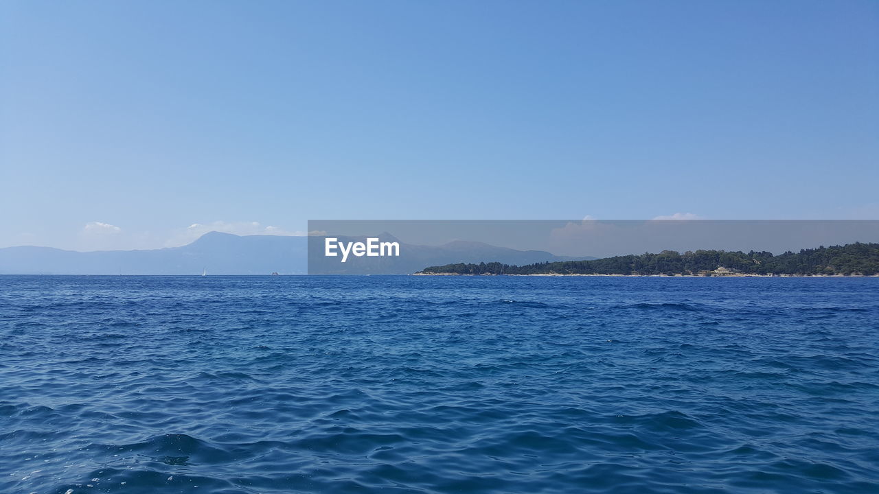 SCENIC VIEW OF SEA AGAINST BLUE SKY