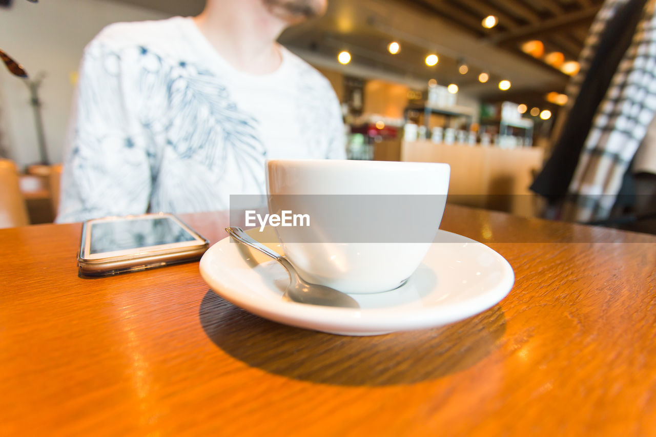 Coffee cup on table in restaurant