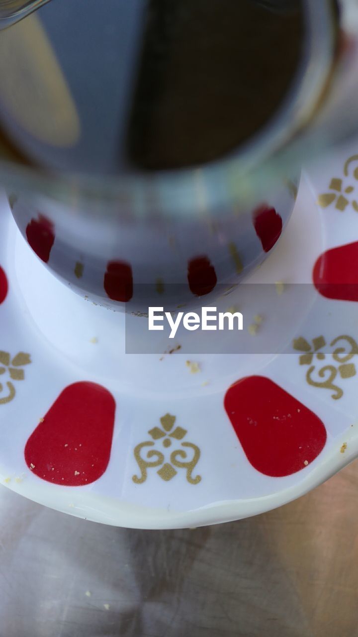 High angle view of glass of tea on table