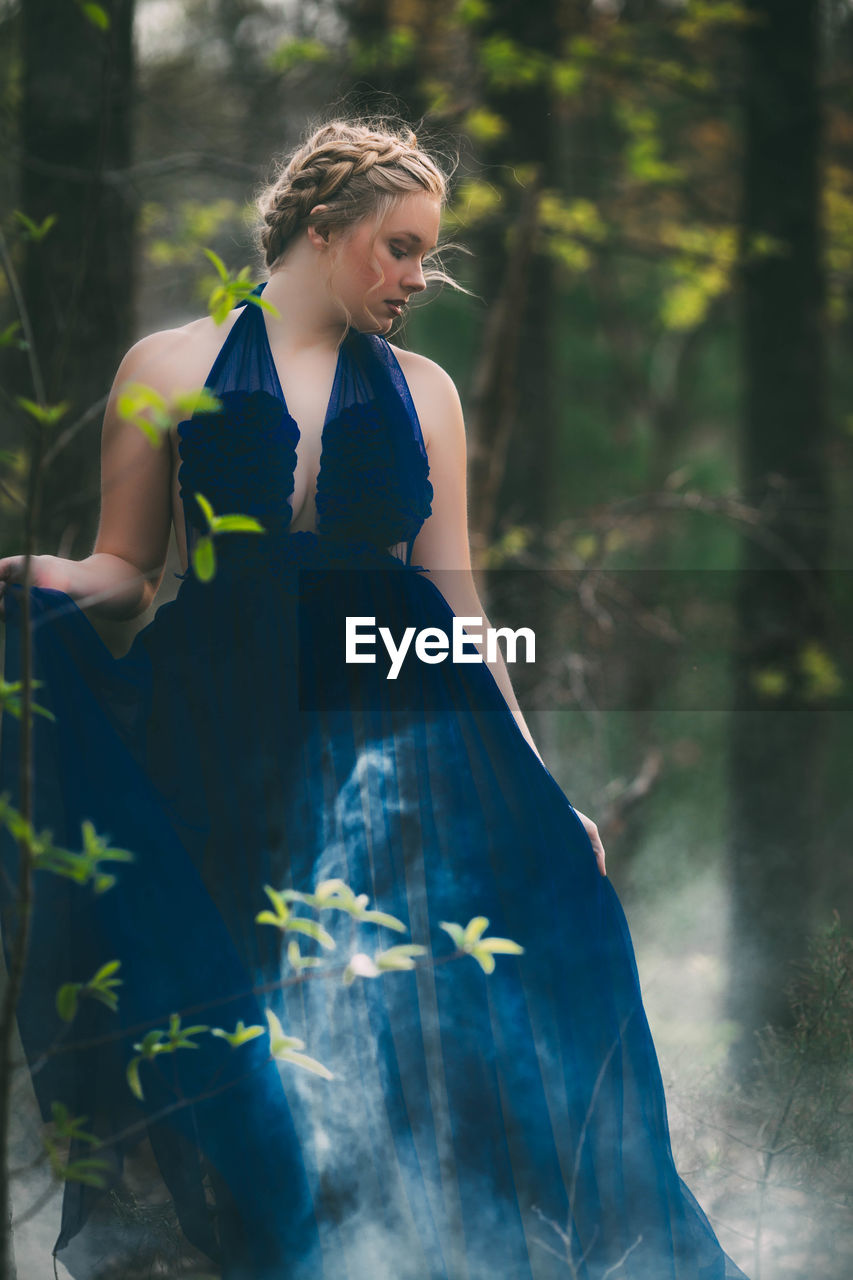 Young woman wearing blue dress