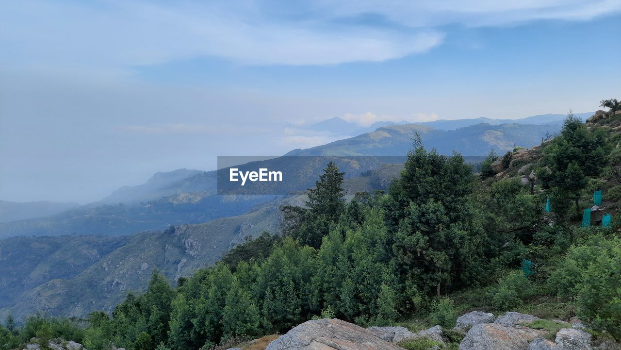 Beautiful scenic view from kodanad view point ooty of misty rain cloud hill mountain green forest