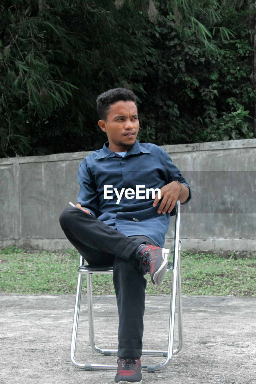 Portrait of boy sitting on chair