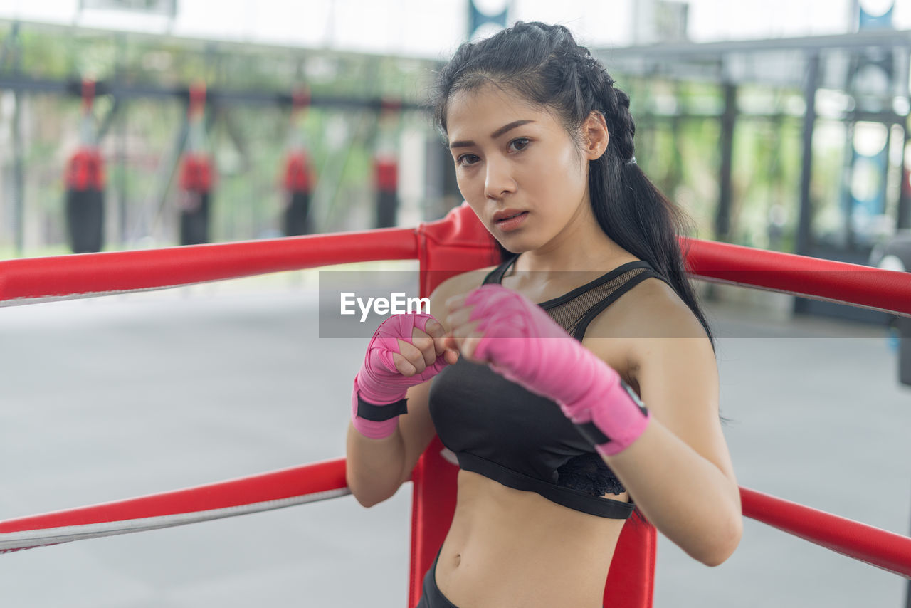 Young woman exercising at gym