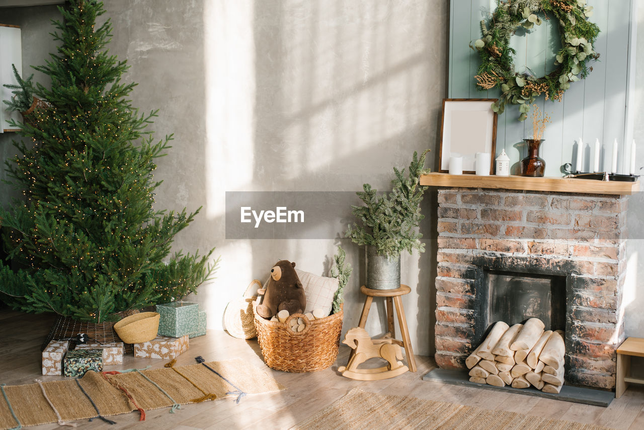 Modern concept of christmas interior design. cozy living room decorated with a wreath, a christmas 
