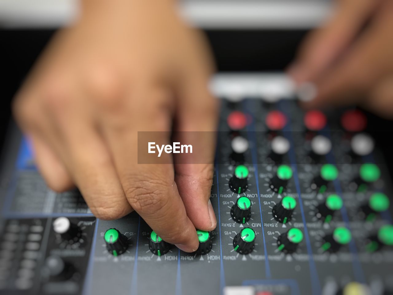 Close-up of person playing sound mixer