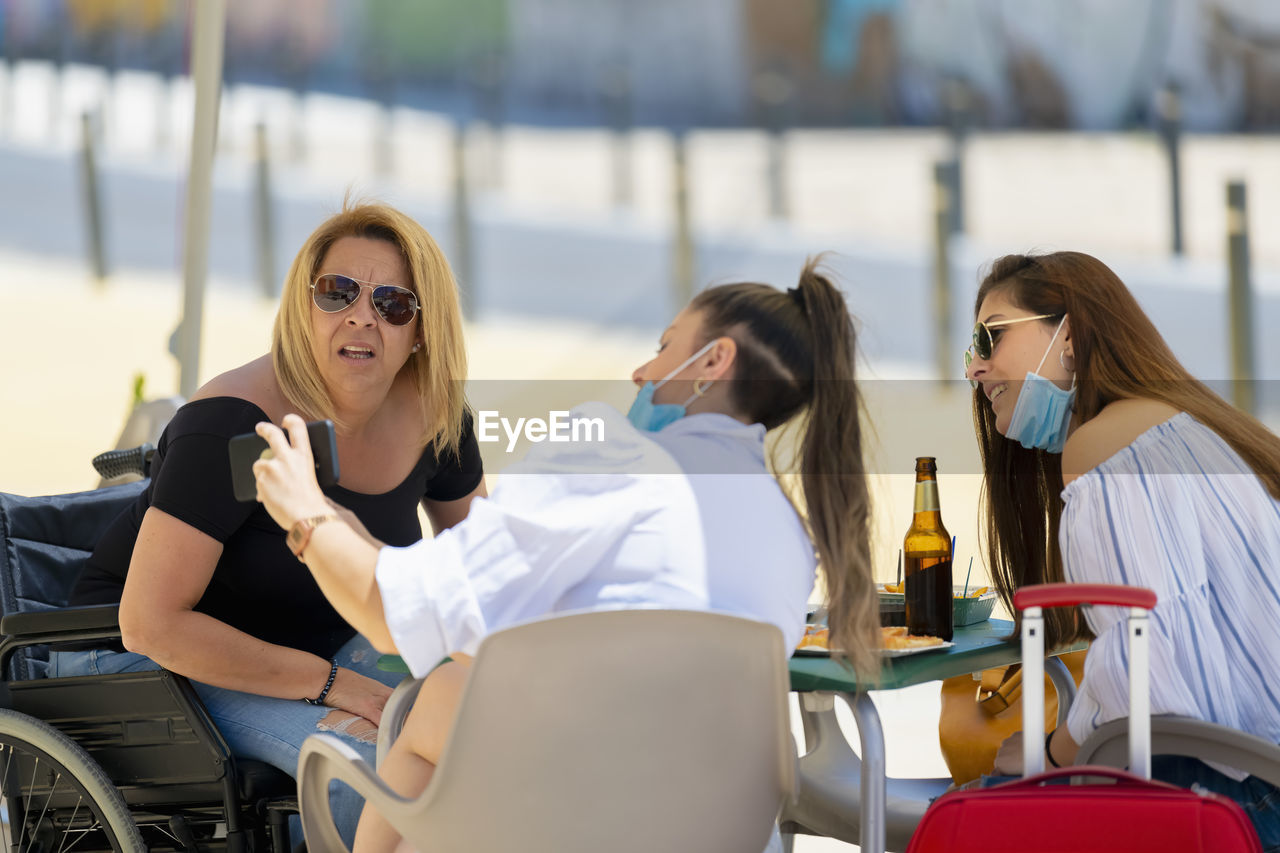 Young women sitting on table in cafe