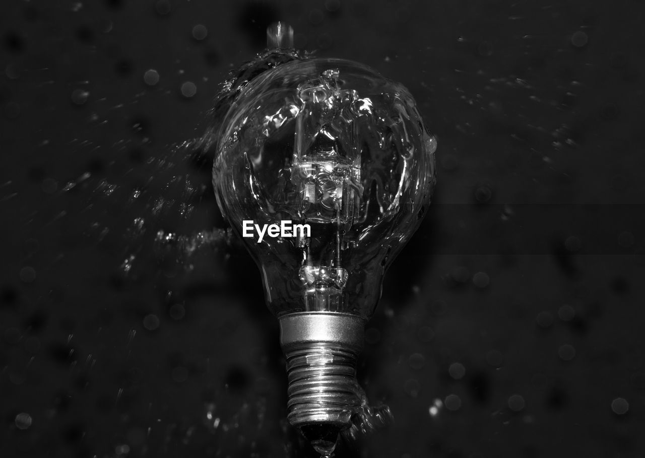 High angle view of water pouring on light bulb