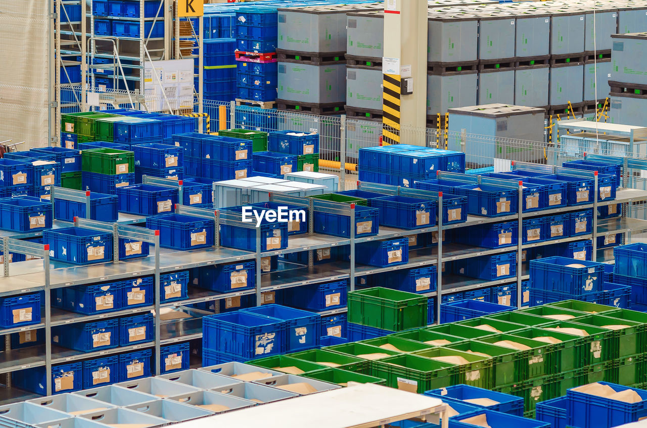 Industrial distribution, composition. storage with high shelves, cargo boxes on racks. 