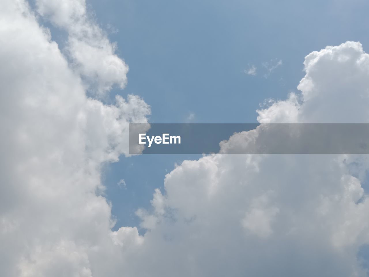 LOW ANGLE VIEW OF CLOUDS IN BLUE SKY