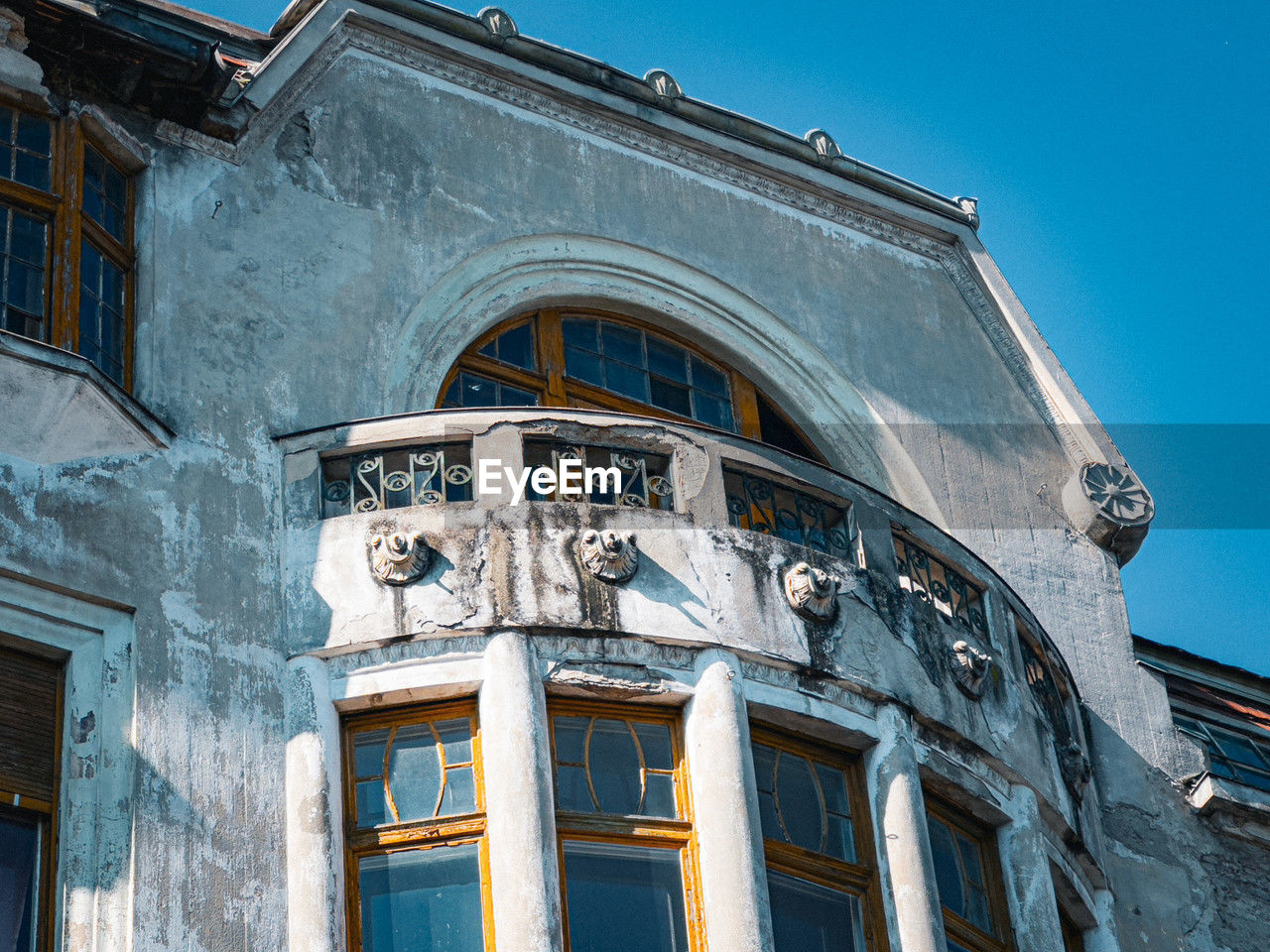 architecture, building exterior, landmark, built structure, blue, urban area, facade, building, history, window, the past, city, no people, low angle view, clear sky, sky, travel destinations, house, nature, town, old, travel, downtown, day, outdoors, tourism, sunny