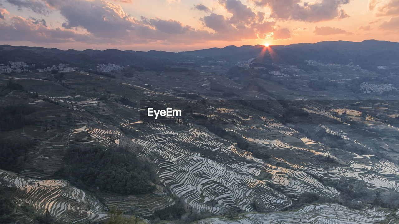 Scenic view of rice terraces at yuanyang county during sunset