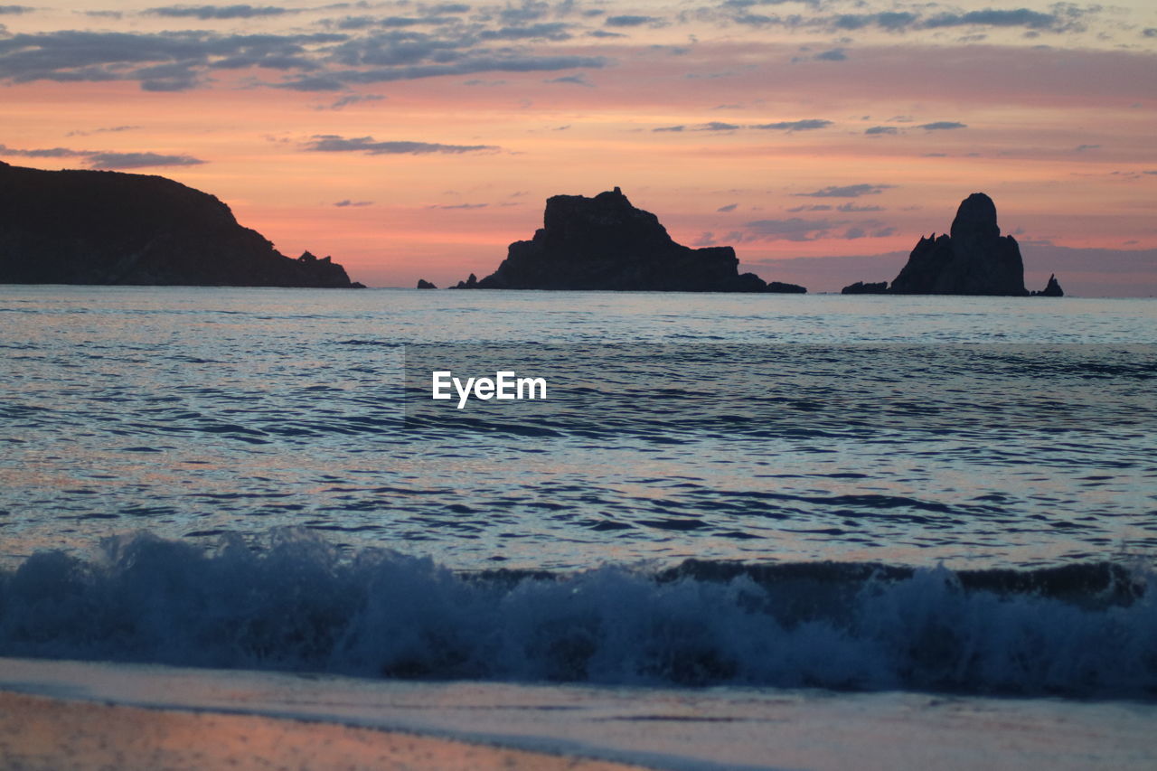 Scenic view of sea against sky during sunset