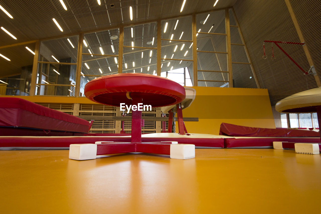 EMPTY CHAIRS AND TABLES IN OFFICE