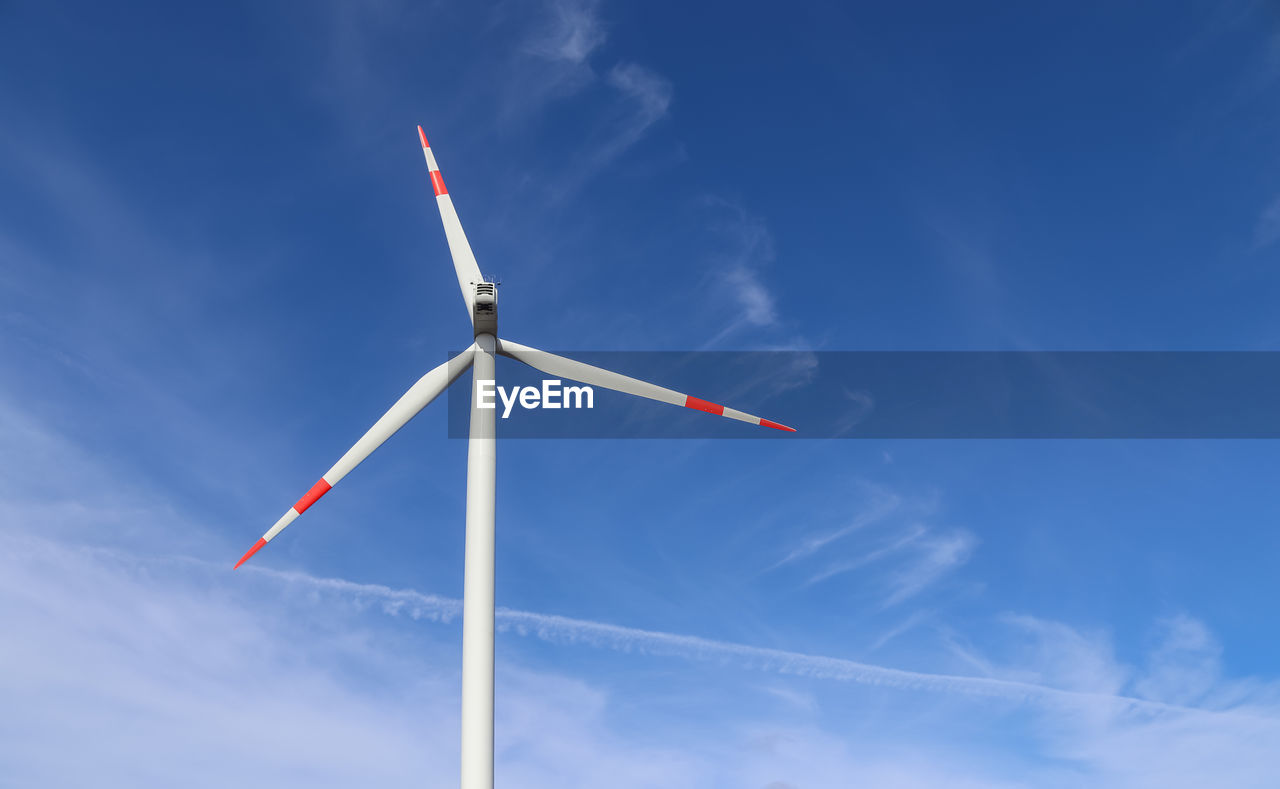 View on alternative energy wind mills against the sky