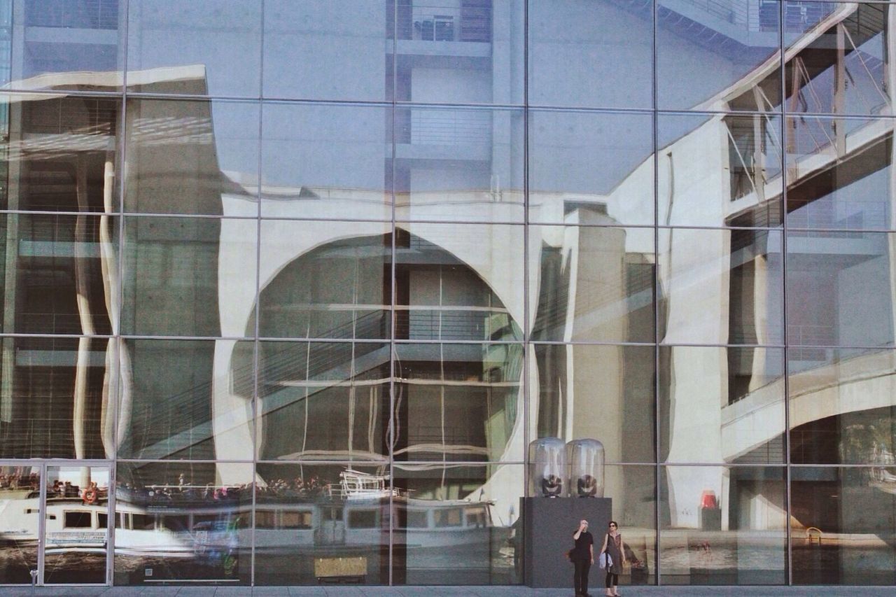 Reflection of boat on building