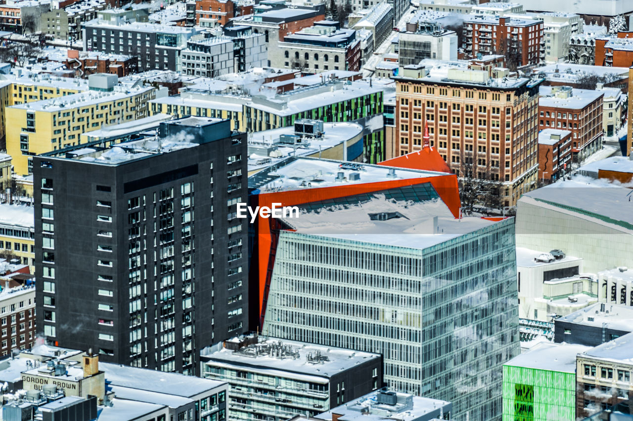 High angle view of buildings in city during winter