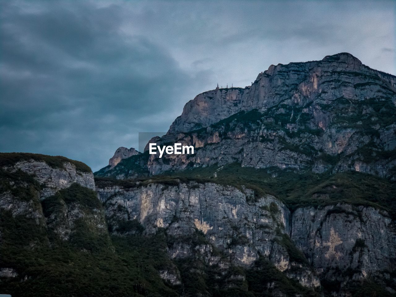 Low angle view of rock formation against sky