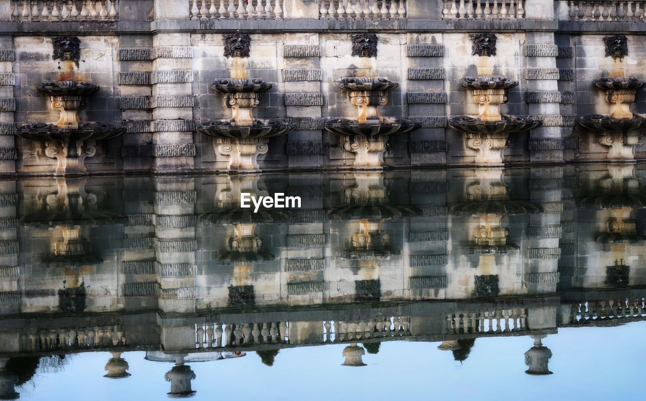 DIGITAL COMPOSITE IMAGE OF BUILDING AND LAKE