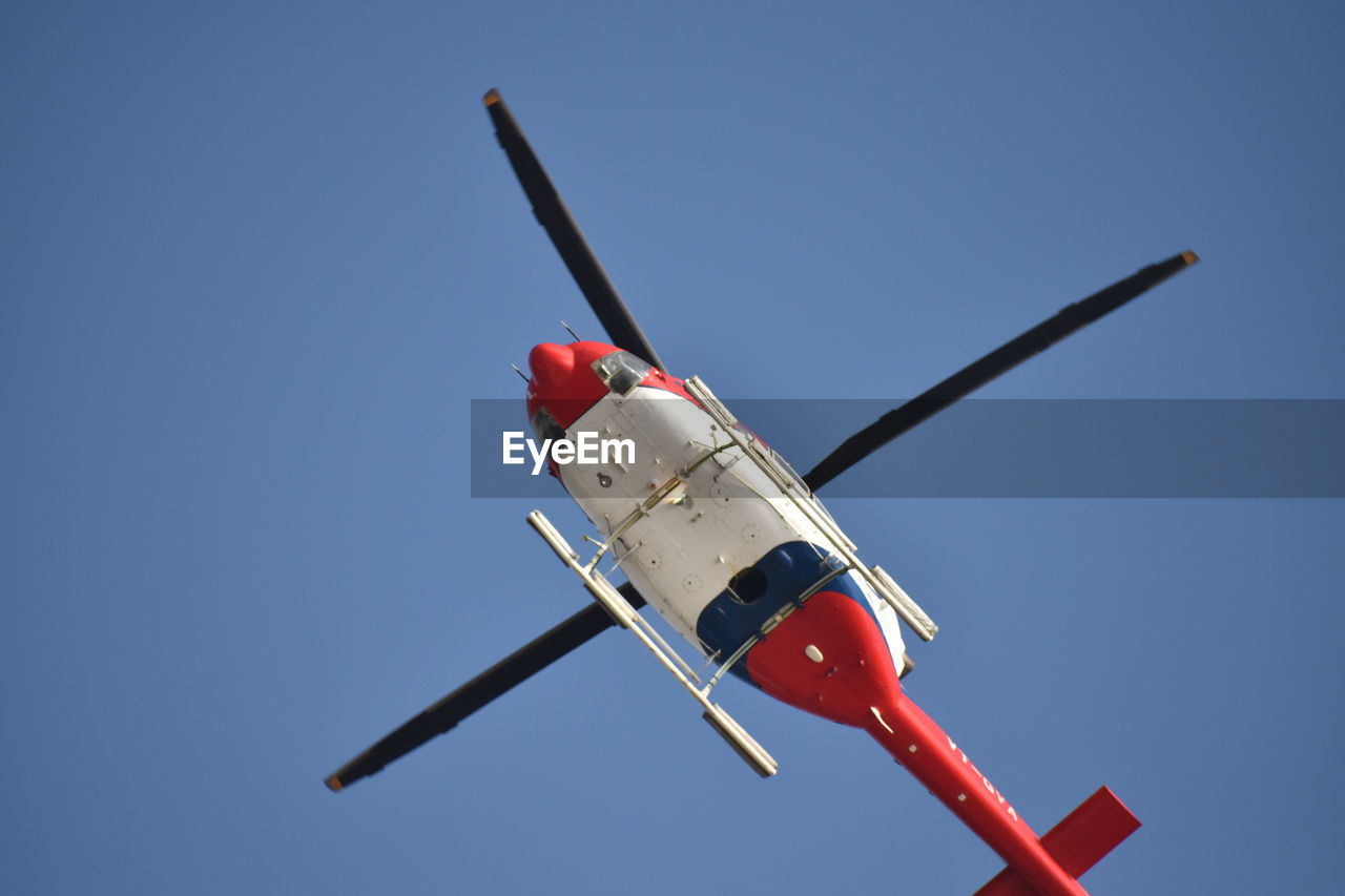 LOW ANGLE VIEW OF AIRPLANE AGAINST SKY