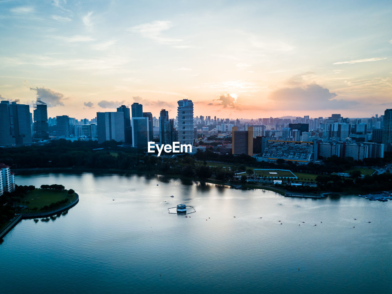 City at waterfront during sunset