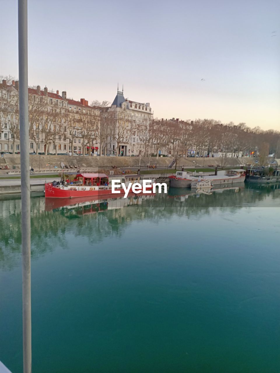 VIEW OF BUILDINGS BY RIVER