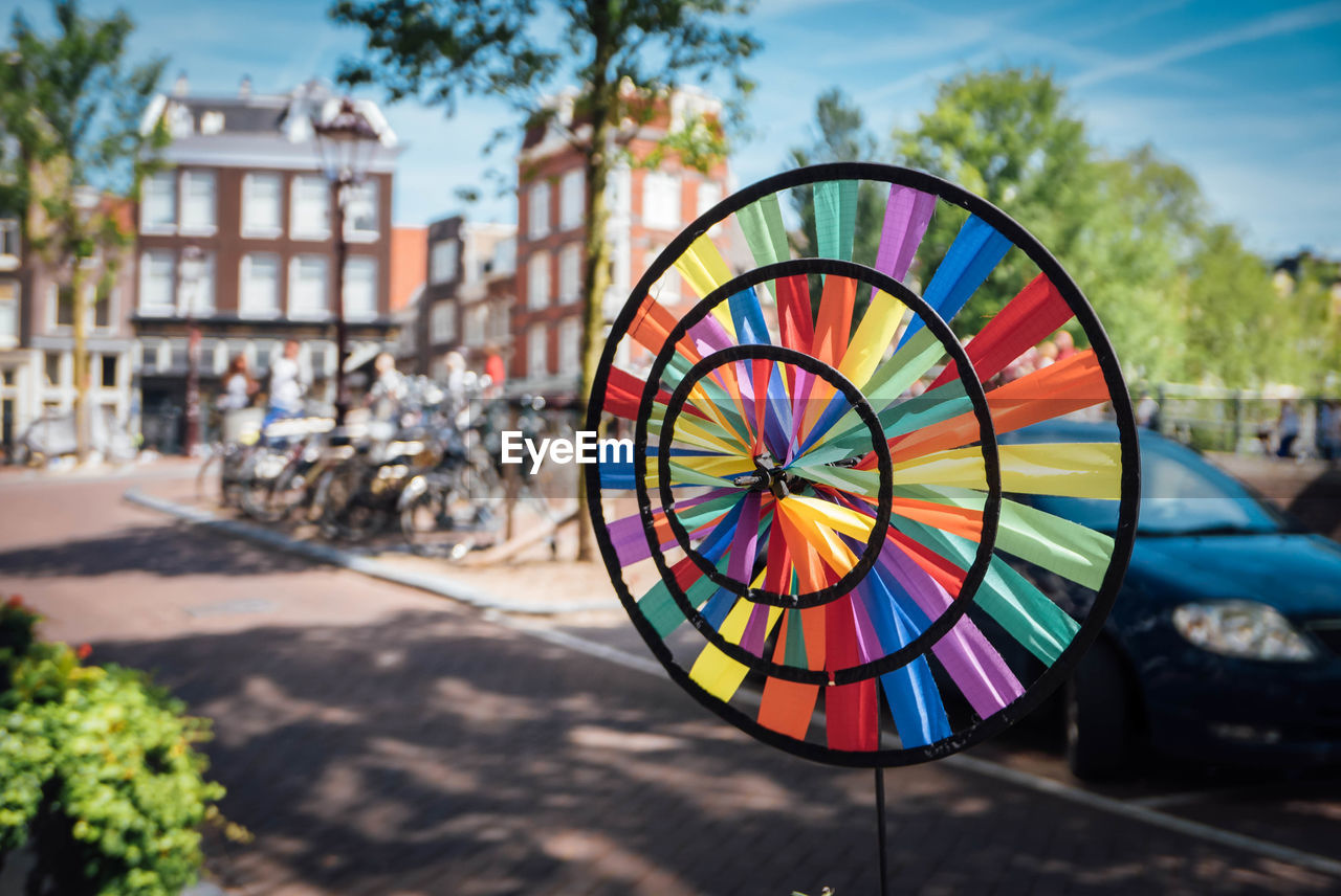 Close-up of colorful pinwheel toy by street