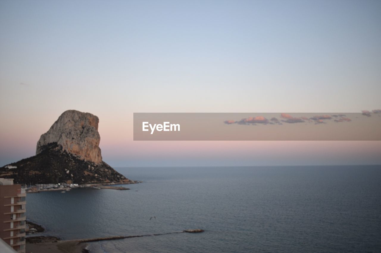 Scenic view of sea against sky at sunset