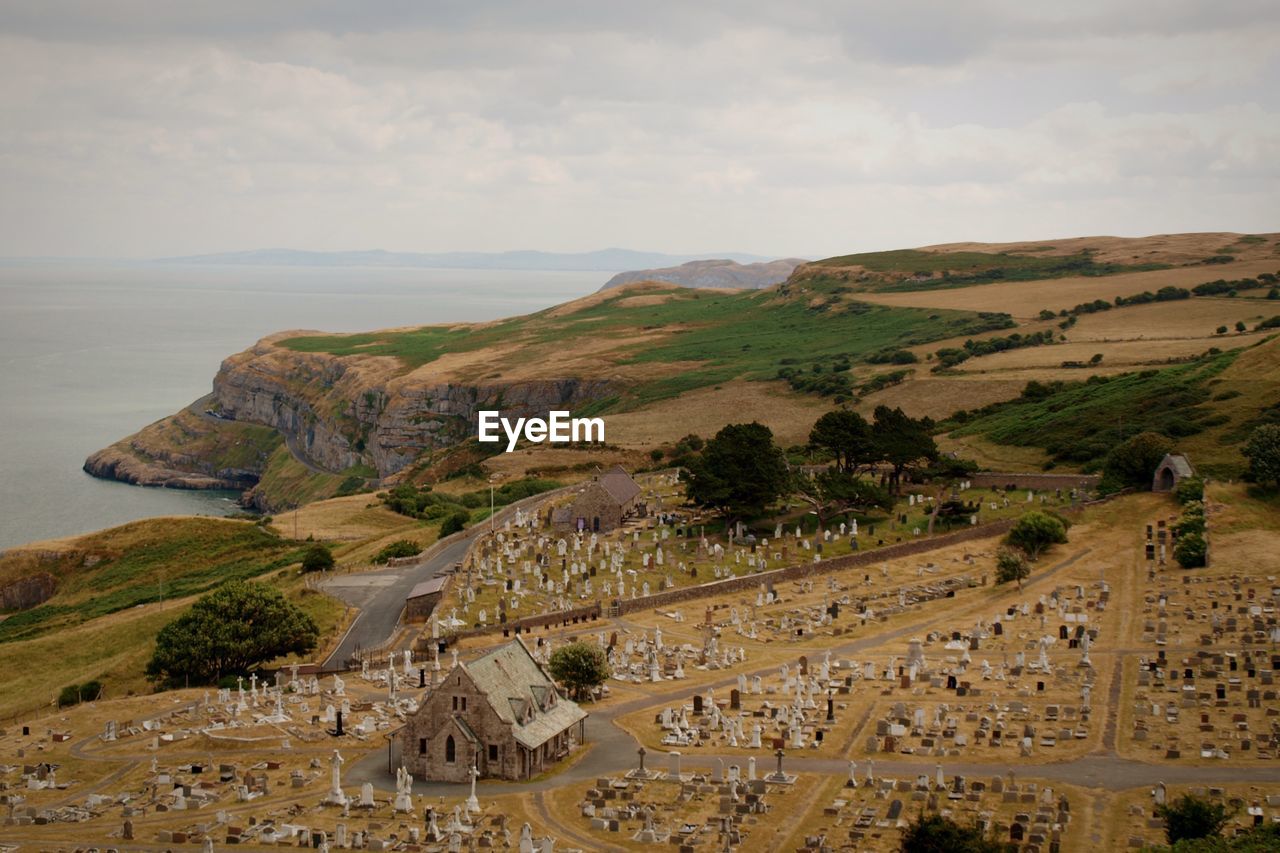 High angle view of church and cemetery against sky