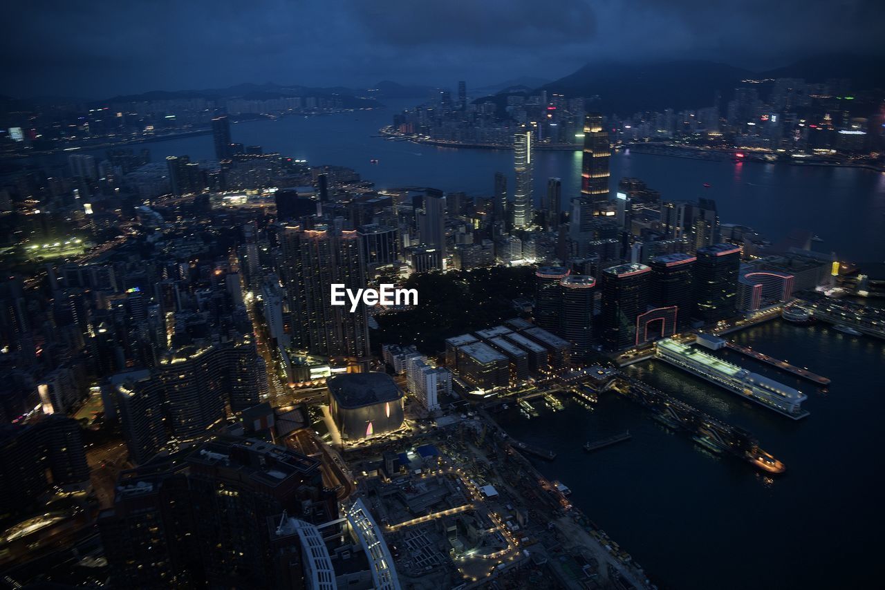 High angle view of illuminated city buildings at night