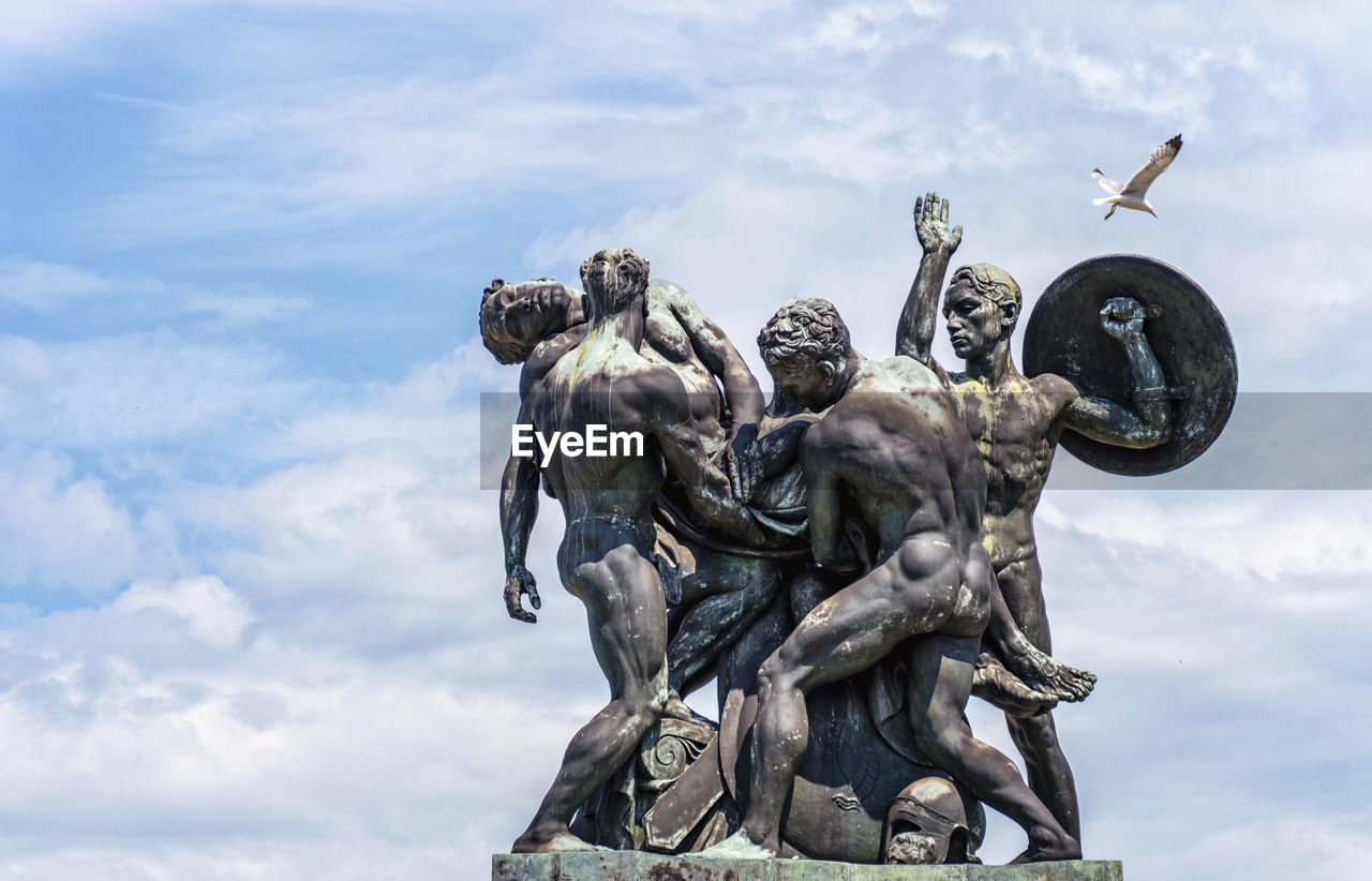 sculpture, cloud, statue, sky, monument, nature, architecture, human representation, representation, person, history, the past, day, art, outdoors, travel destinations, craft, bronze sculpture, male likeness