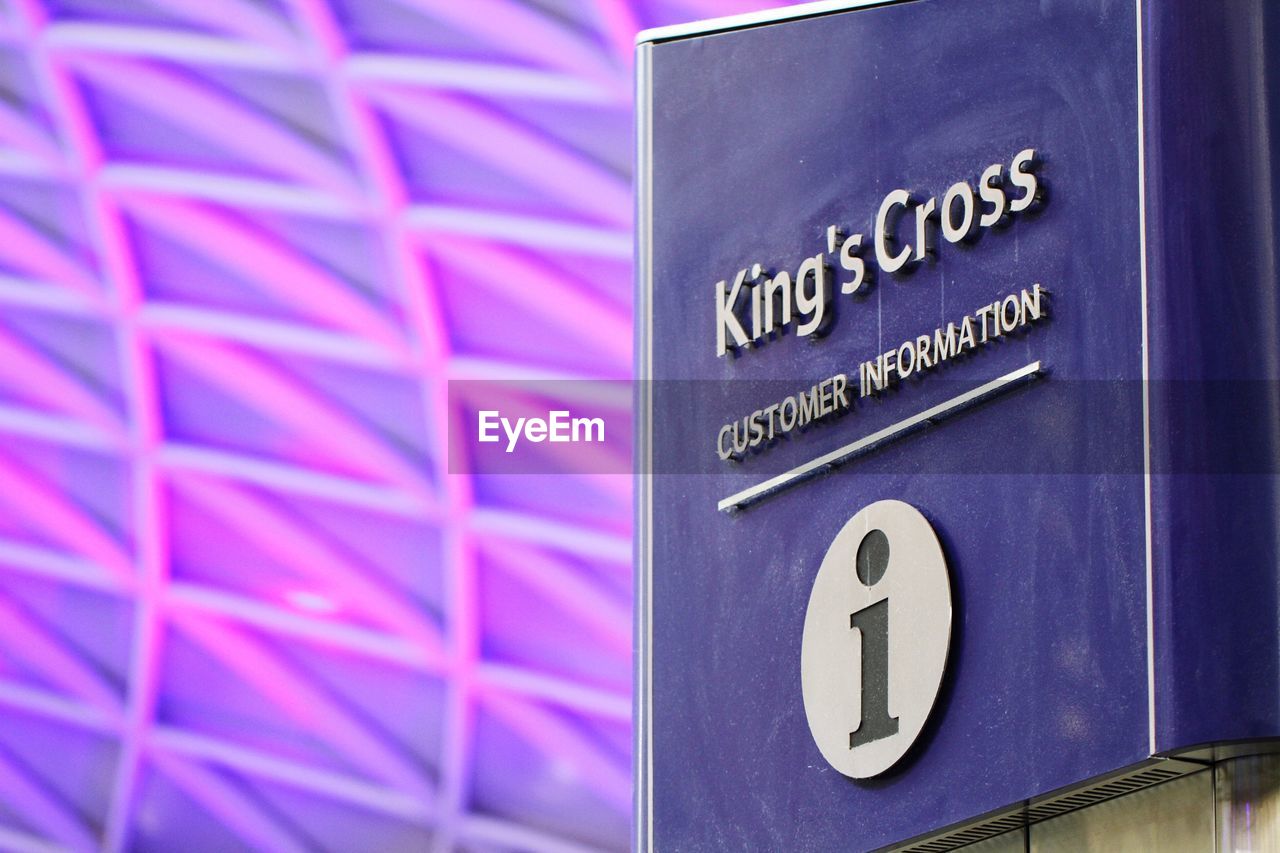 Text with information sign at kings cross station