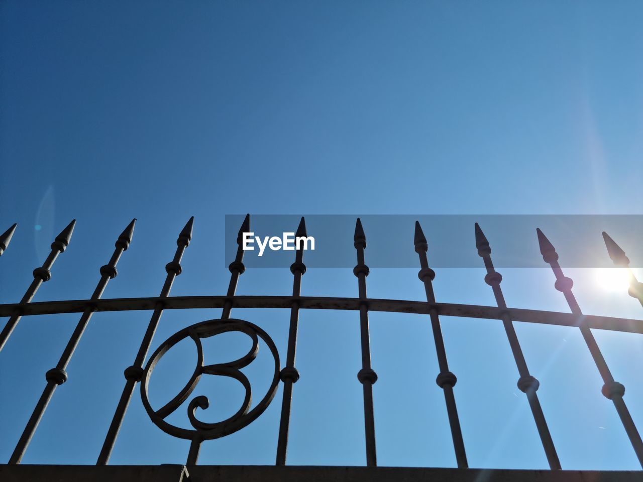 LOW ANGLE VIEW OF FENCE AGAINST CLEAR SKY