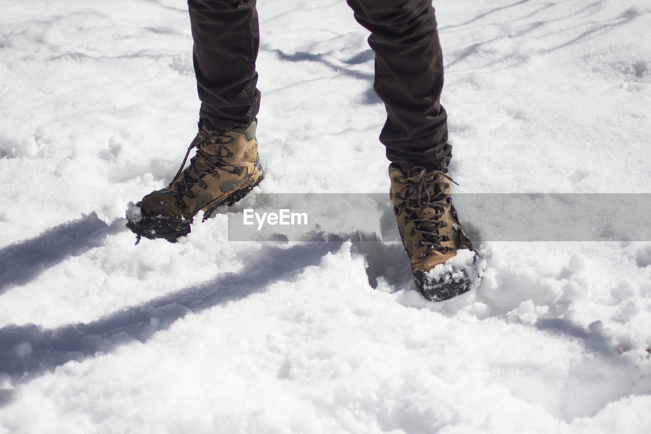 Low section of man on snow