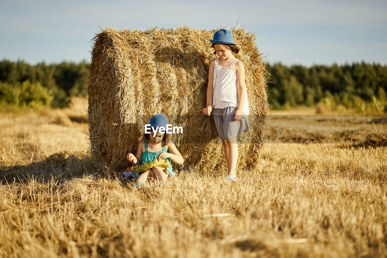 FULL LENGTH OF CHILDREN ON FIELD