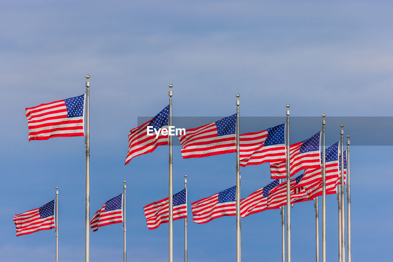 LOW ANGLE VIEW OF FLAGS FLAG AGAINST SKY