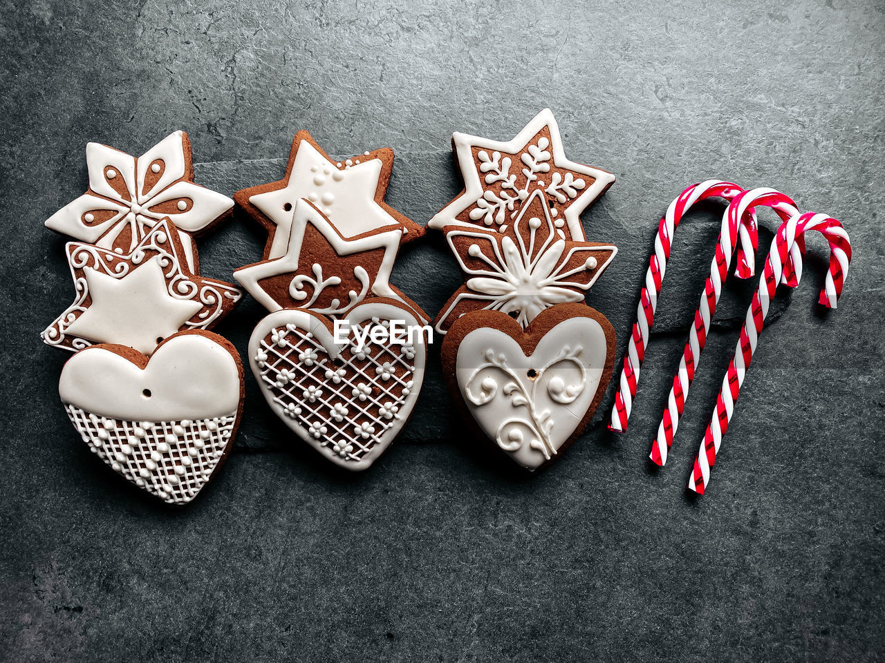 HIGH ANGLE VIEW OF HEART SHAPE AND COOKIES ON TABLE