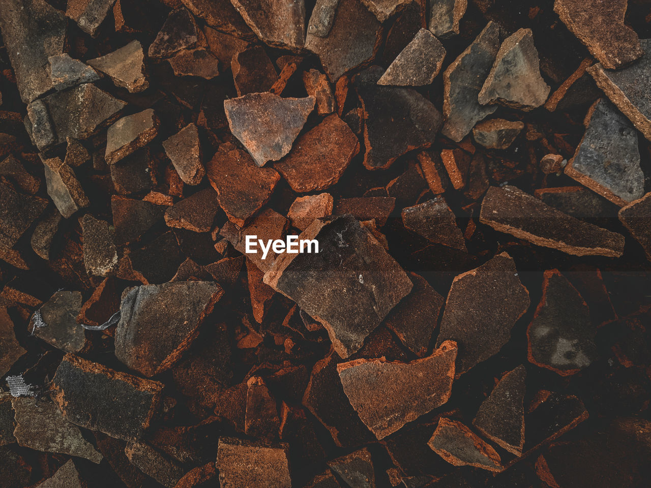 HIGH ANGLE VIEW OF STONES ON ROCK