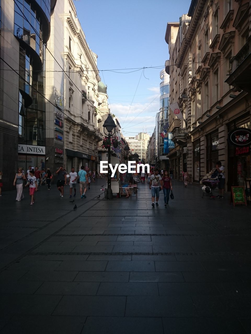 PEOPLE ON ROAD IN CITY