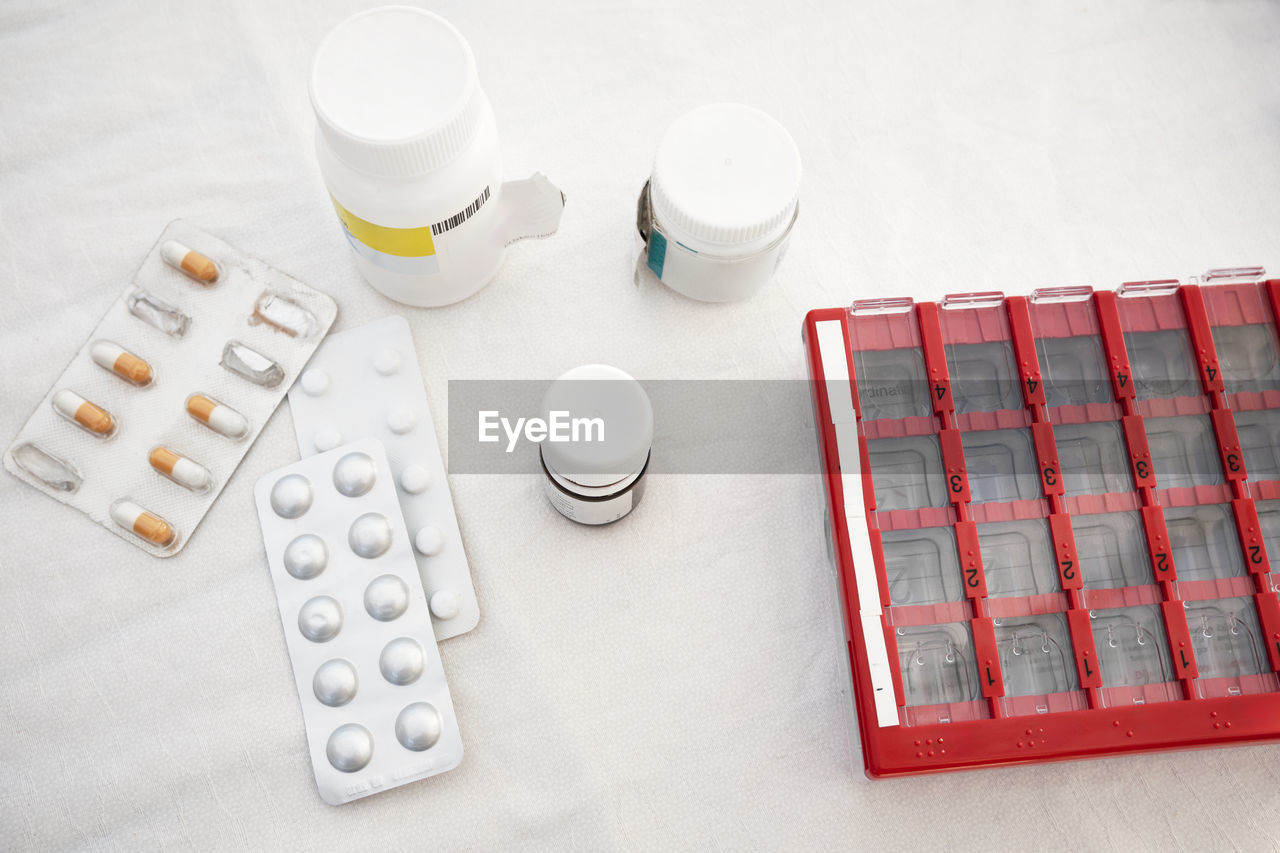 Various pills and medications at table