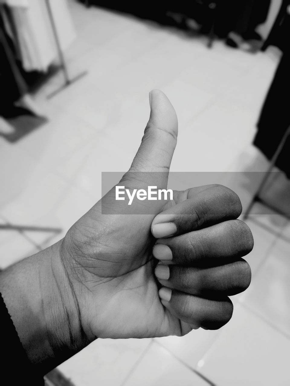 hand, black, white, black and white, finger, monochrome, monochrome photography, one person, adult, focus on foreground, indoors, close-up, gesturing, arm, holding