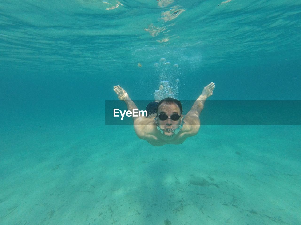 Portrait of man swimming in sea