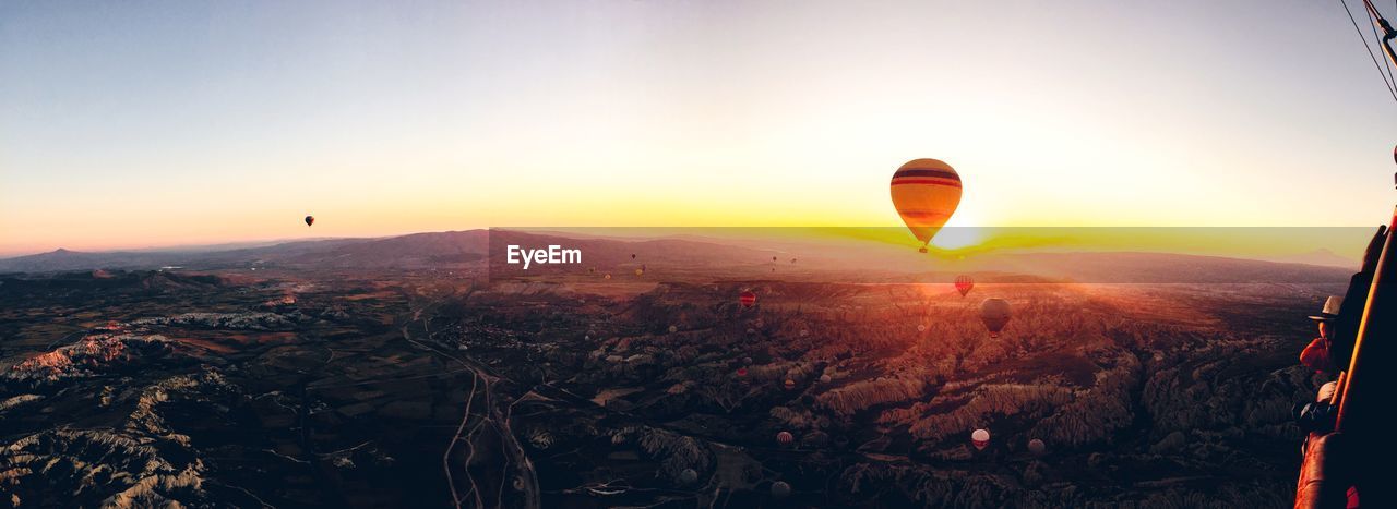 Aerial view of hot air balloons and landscape