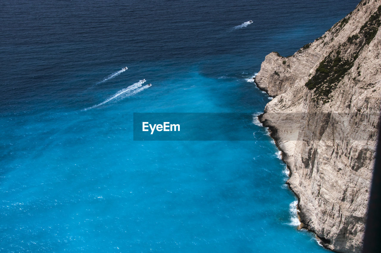 High angle view of sea against blue sky